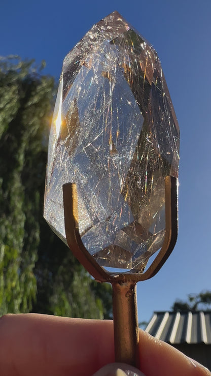 Faceted Rutile Smokey Quartz on stand